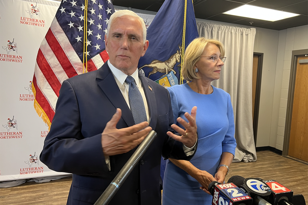 Mike Pence next to Betsy DeVos
