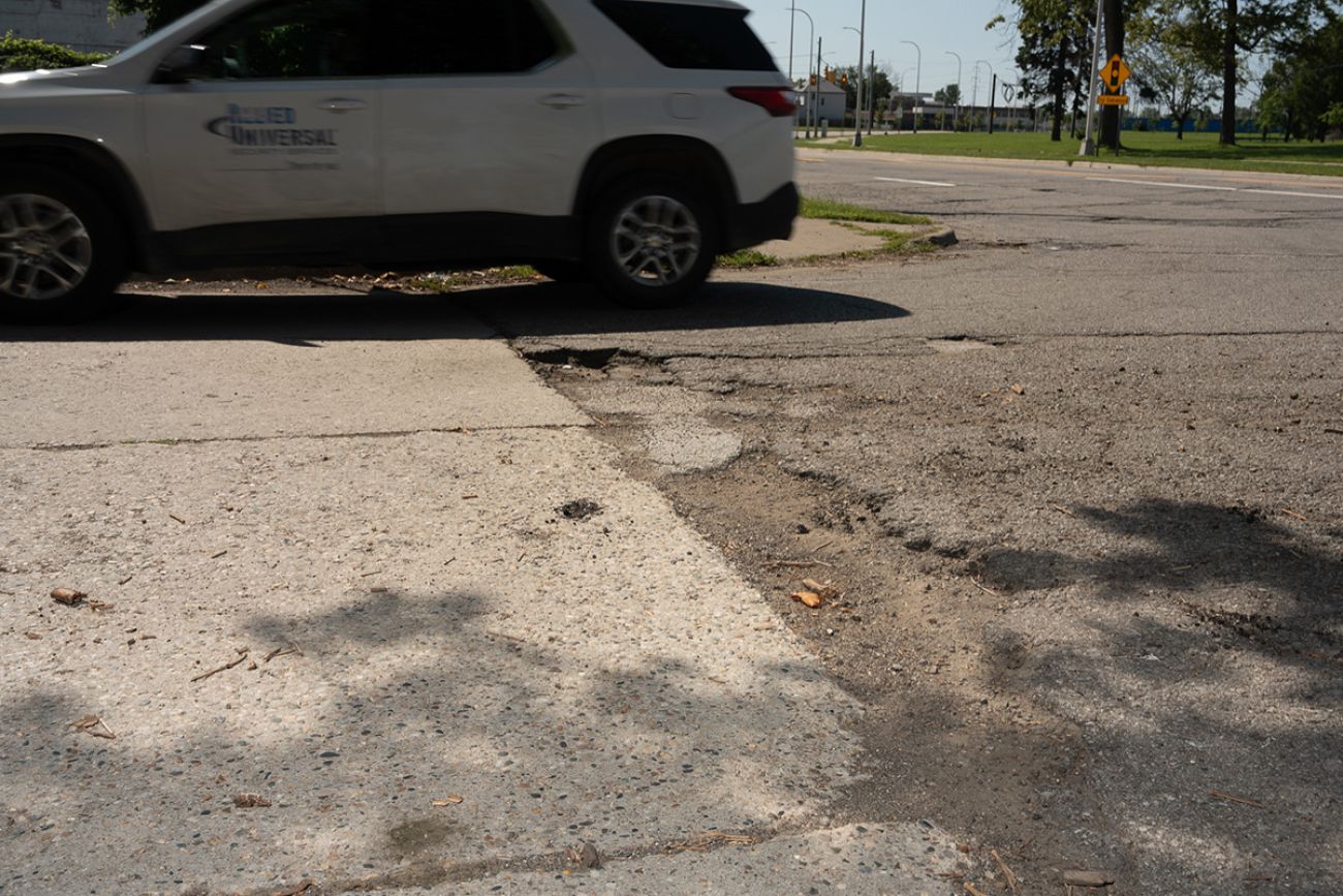 car going over pothole