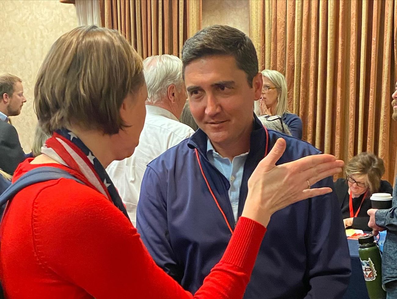 Paul Hudson talks to a person