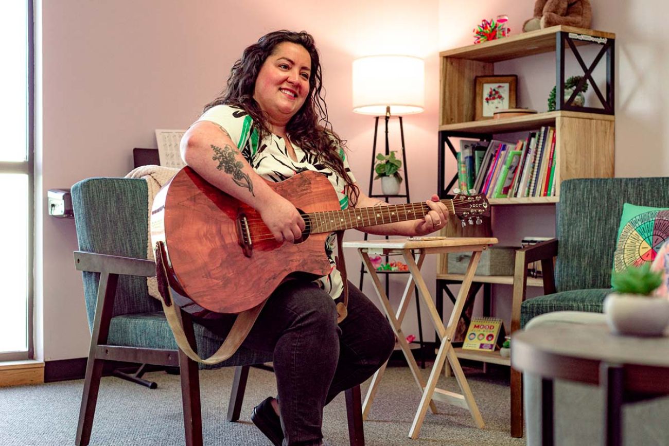 Woman playing the guitar