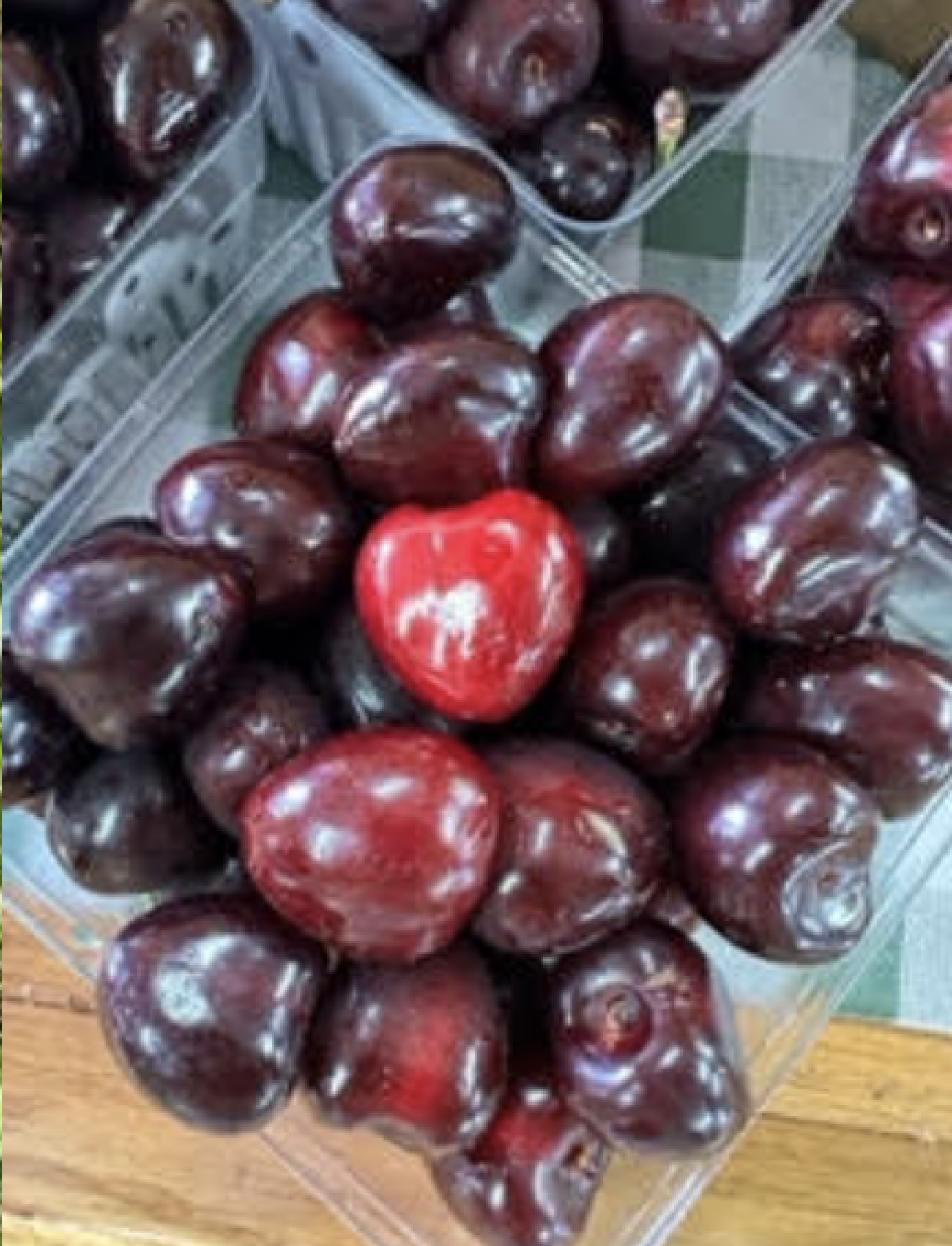 A bunch of cherries in a container