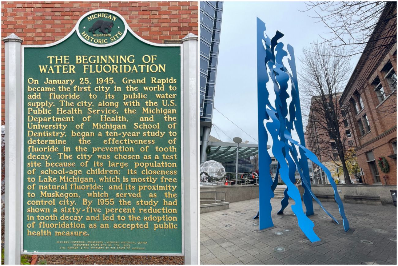 A historical marker on the left and a blue sculpture in downtown Grand Rapids