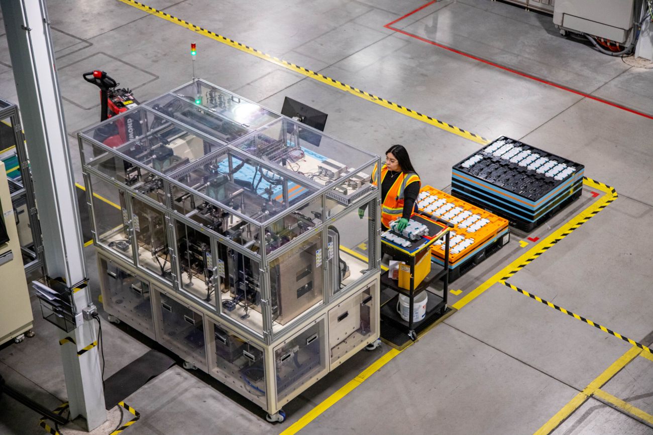 An image of people making EV batteries
