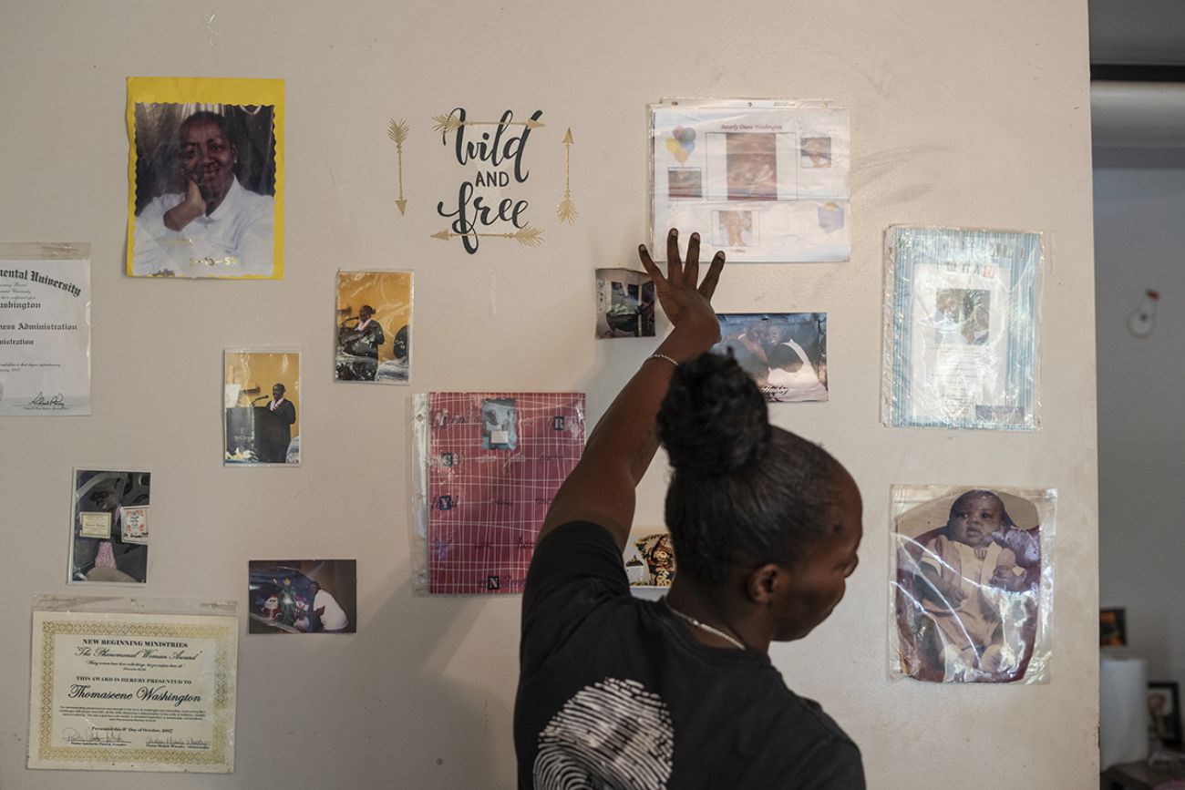A wall with photos taped on it