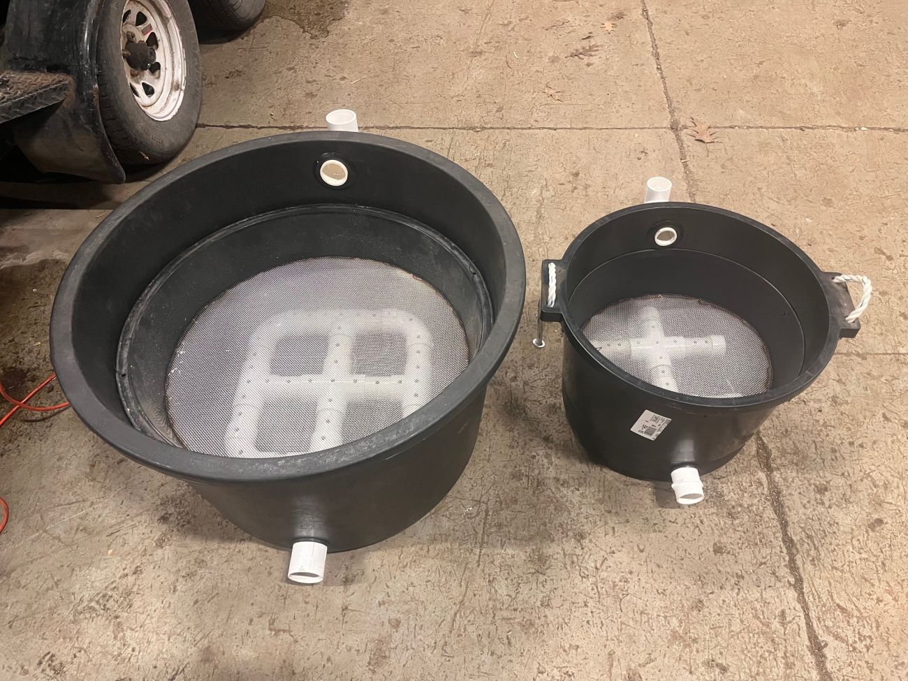 Two black buckets