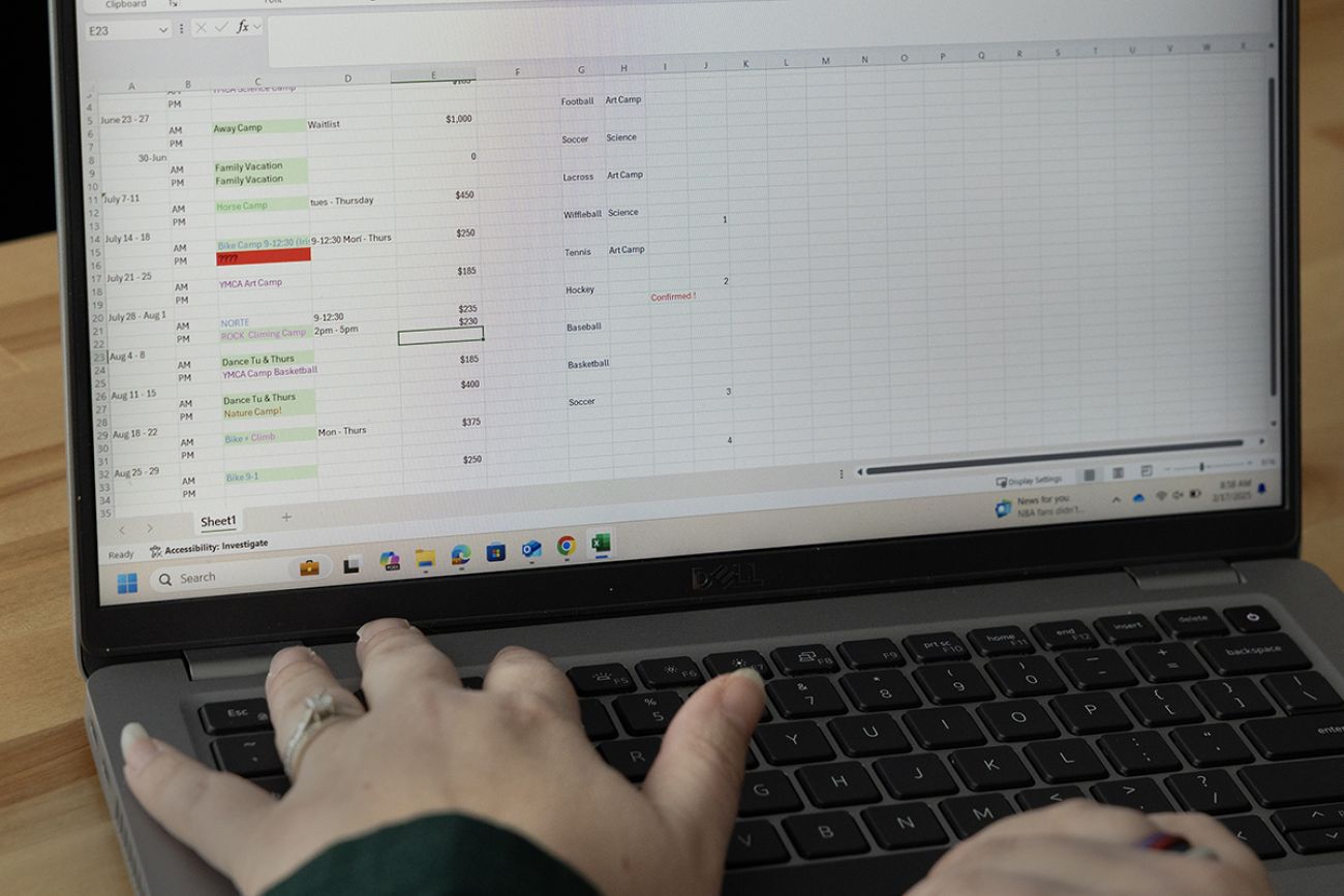 Meg Lau filling out a spreadsheet.