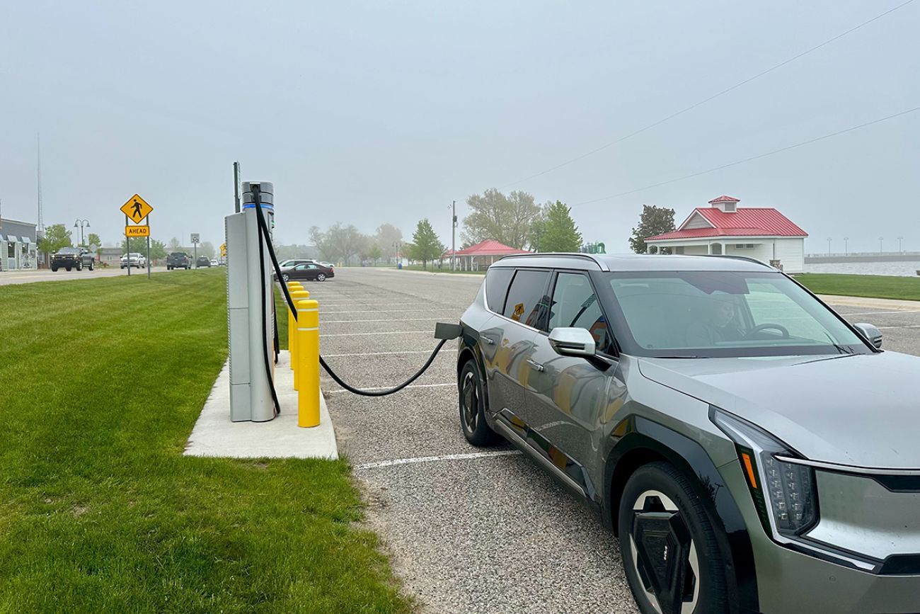 EV car being charged at a charging port.