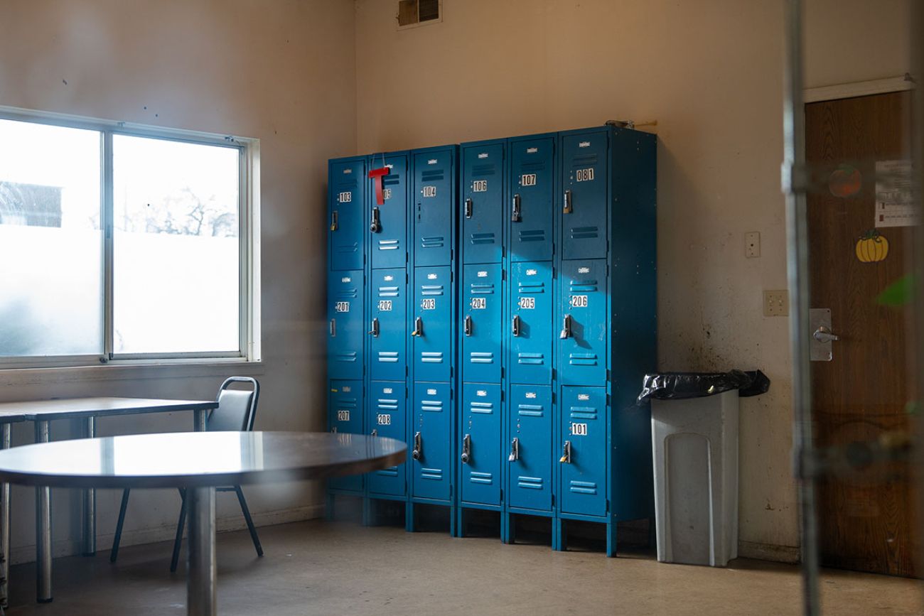 Blue lockers in a break room.