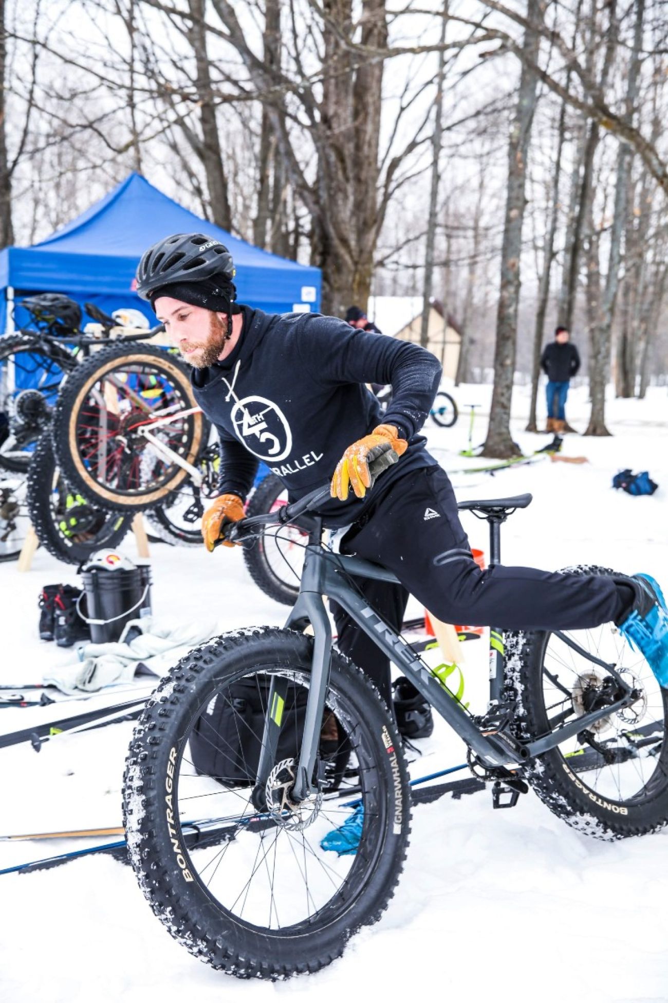 A fat-tire bicyclist in Gaylord. There's a lot of snow on the ground.