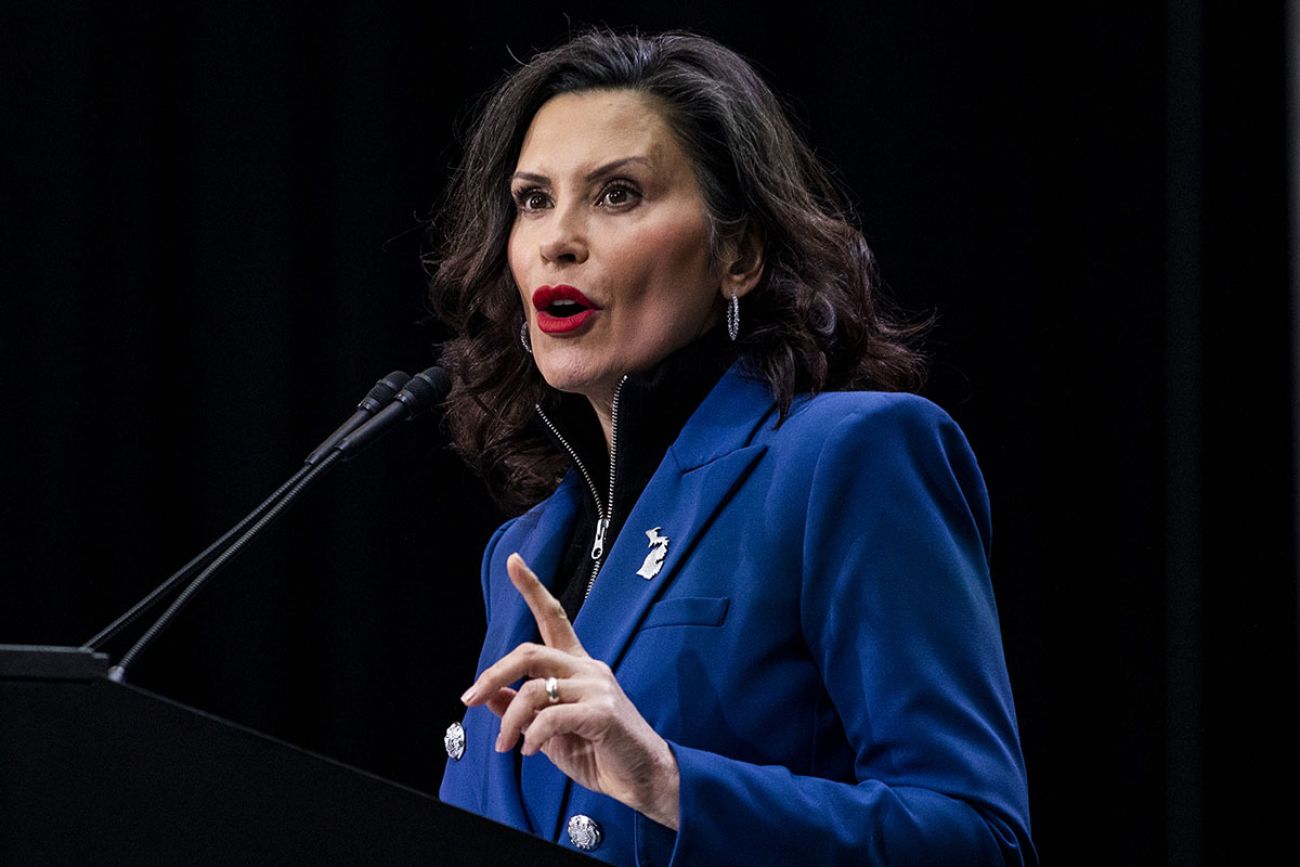 Gov. Gretchen Whitmer speaks into a microphone.