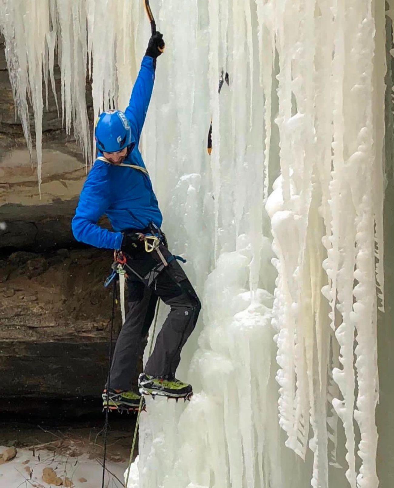 A man ice climbing.