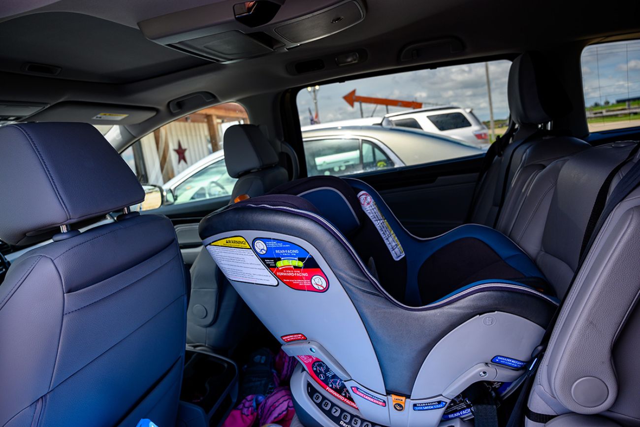 Rear facing infant car seat in a van.