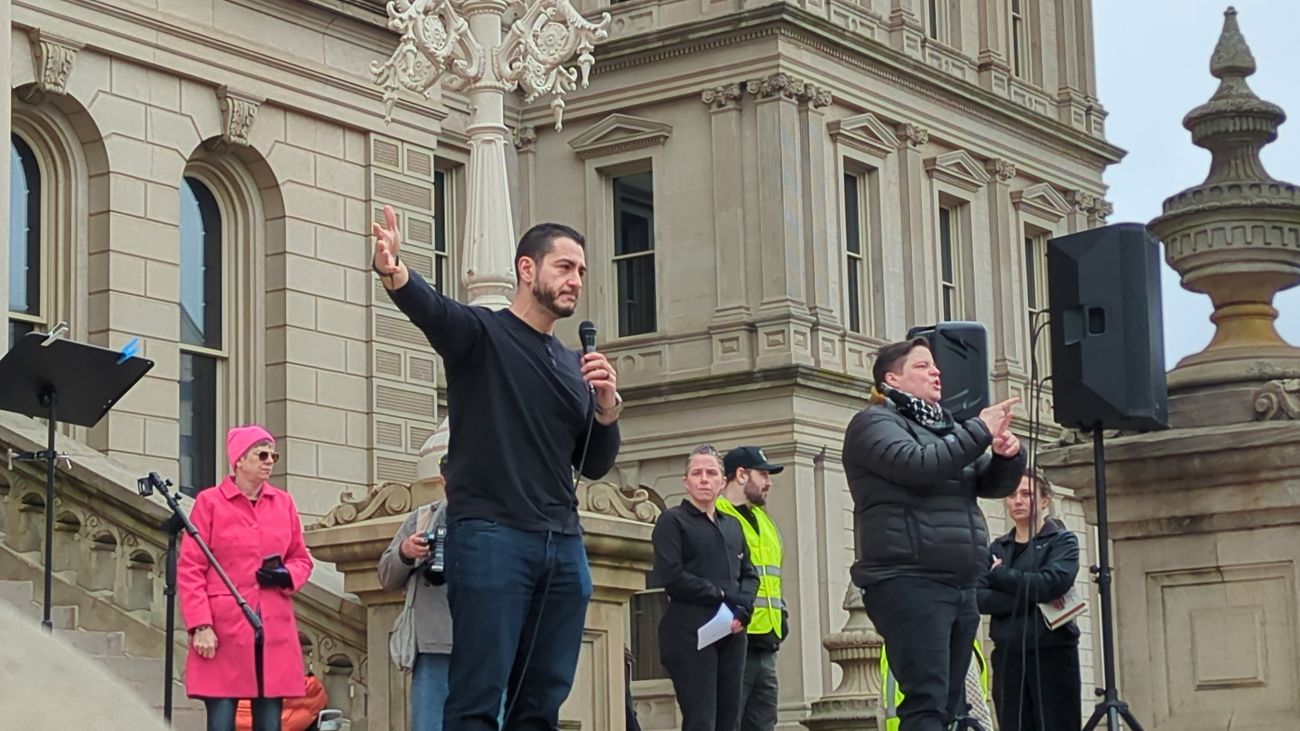 Abdul El-Sayed speaking into a microphone.