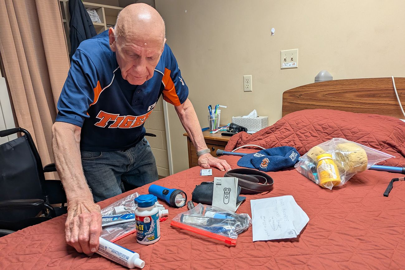 Howard Gregor has medical supplies on a bed.