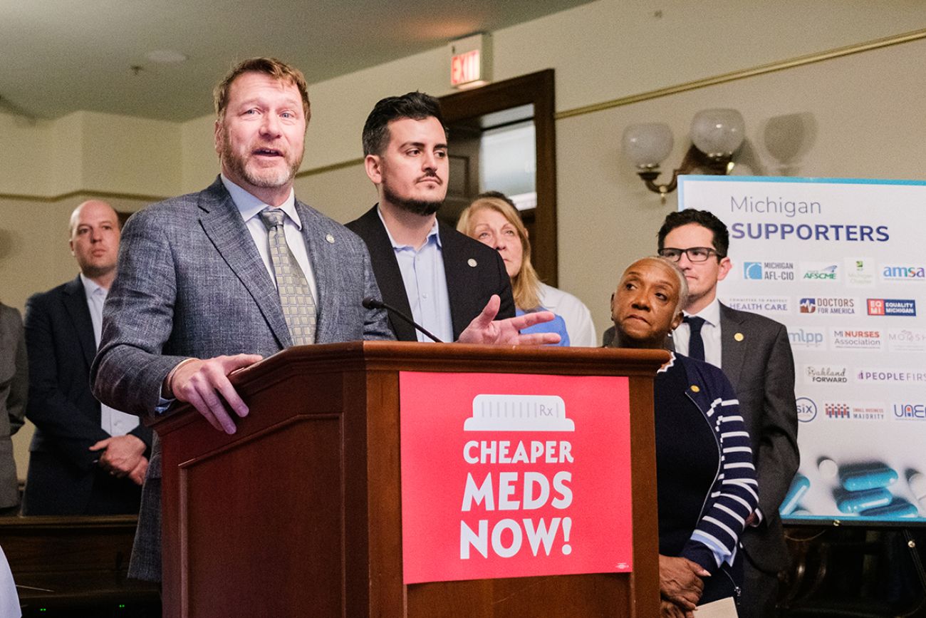Michigan Rep. Matt Longjohn of Portage speaks at a press conference. Other lawmakers are behind him.