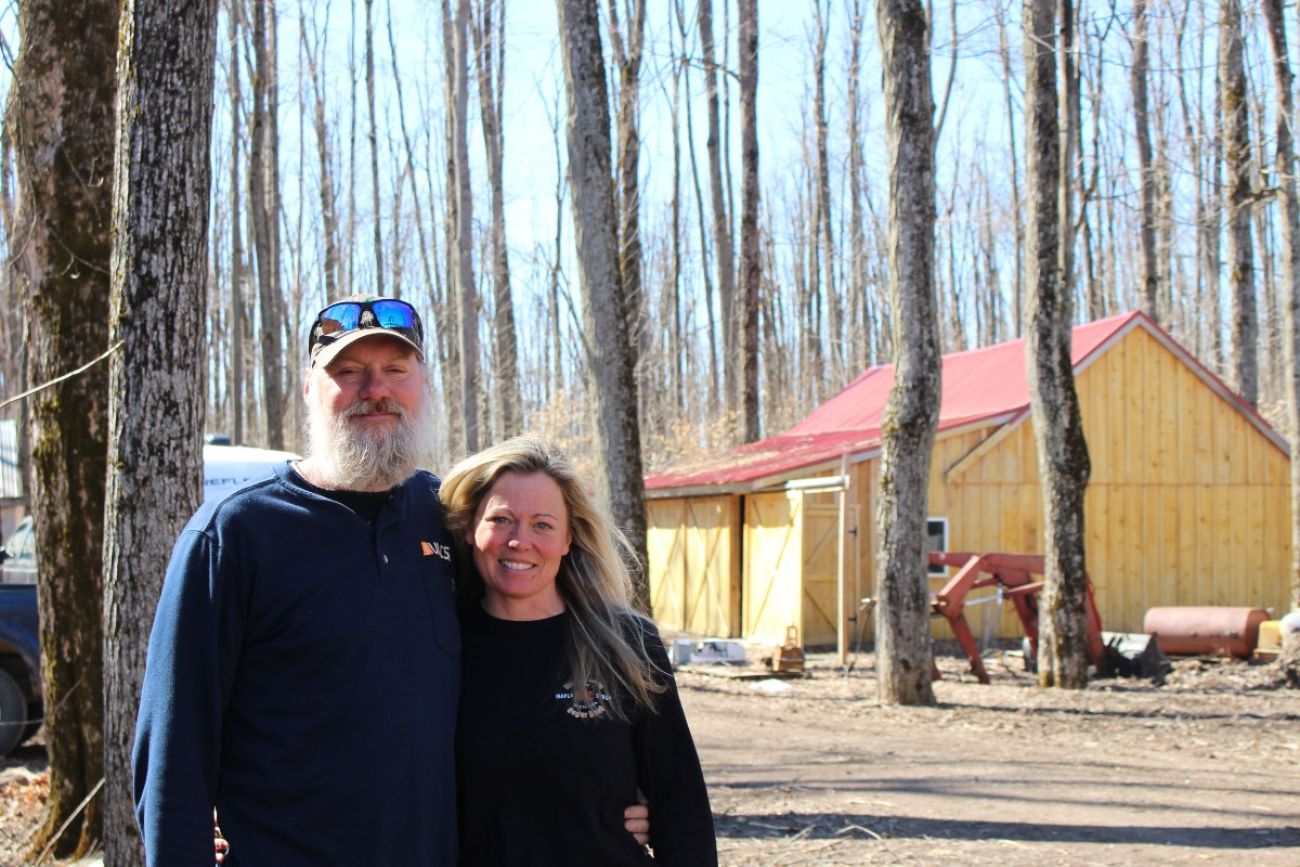 The RiChards pose for a photo on their property
