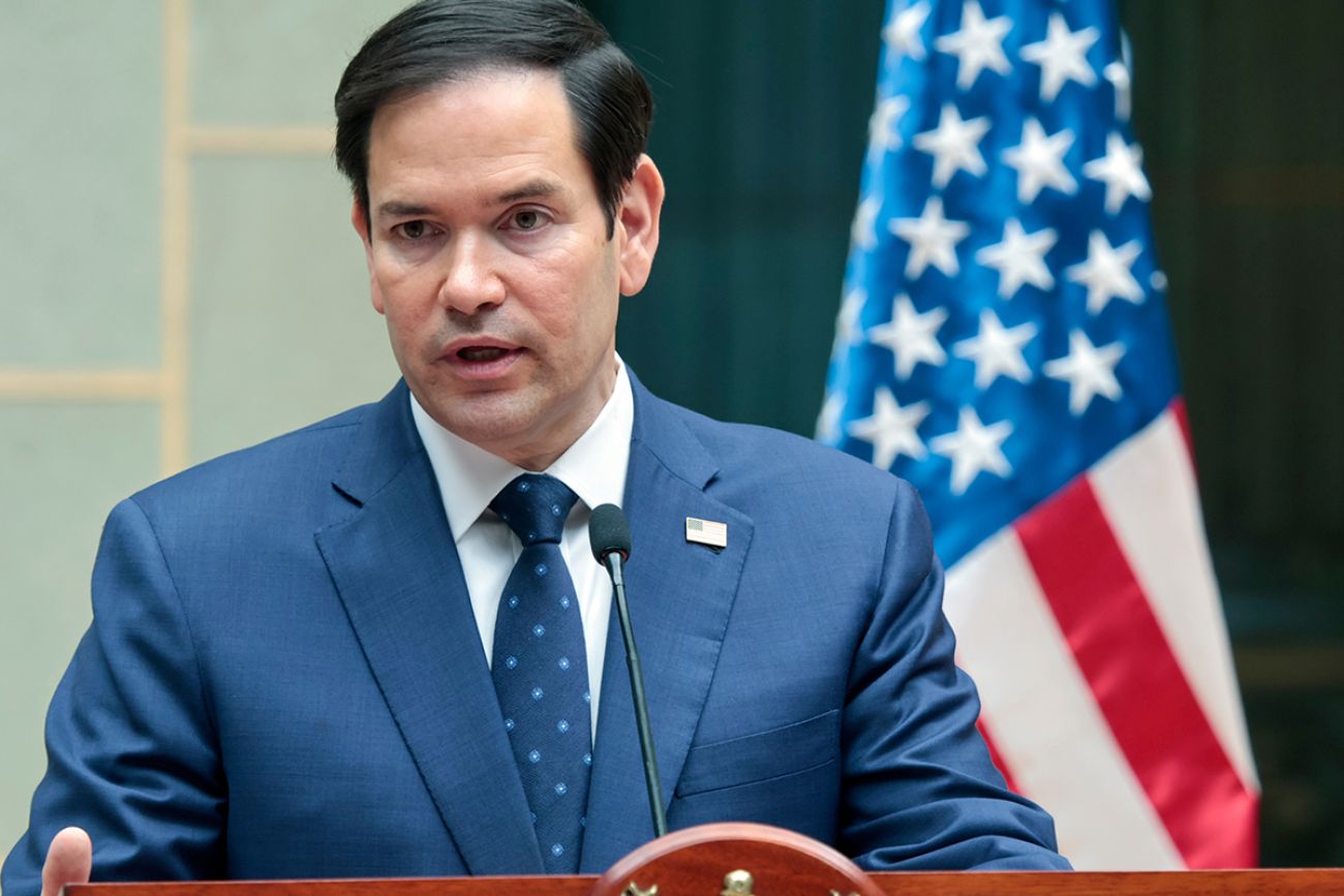 Secretary of State Marco Rubio speaking into a microphone.