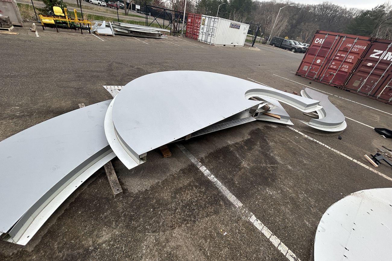 Pieces of dismantled scoreboard on the ground.