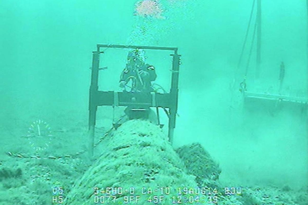 A diver next to Line 5 in the Great Lakes.