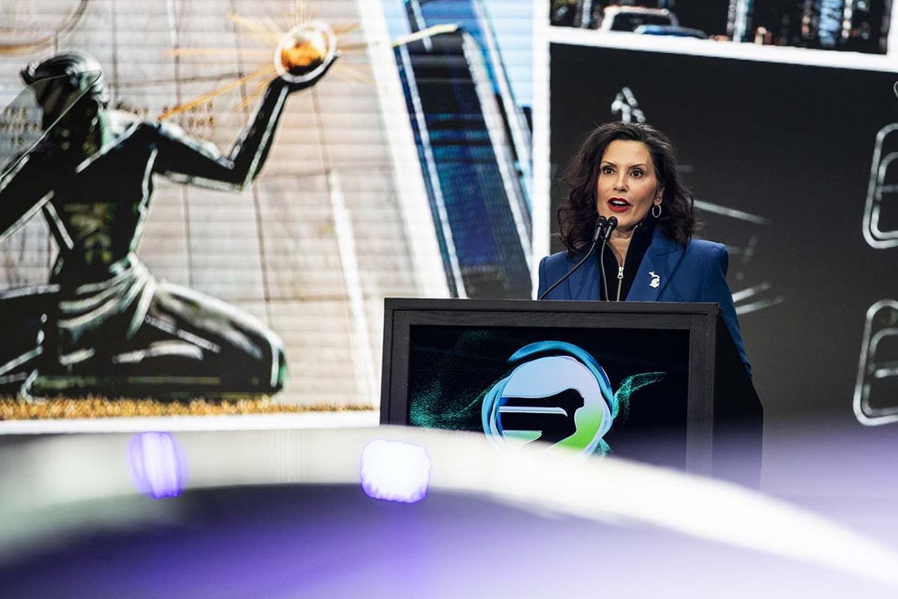 Gov. Gretchen Whitmer speaking at the Detroit Auto Show.