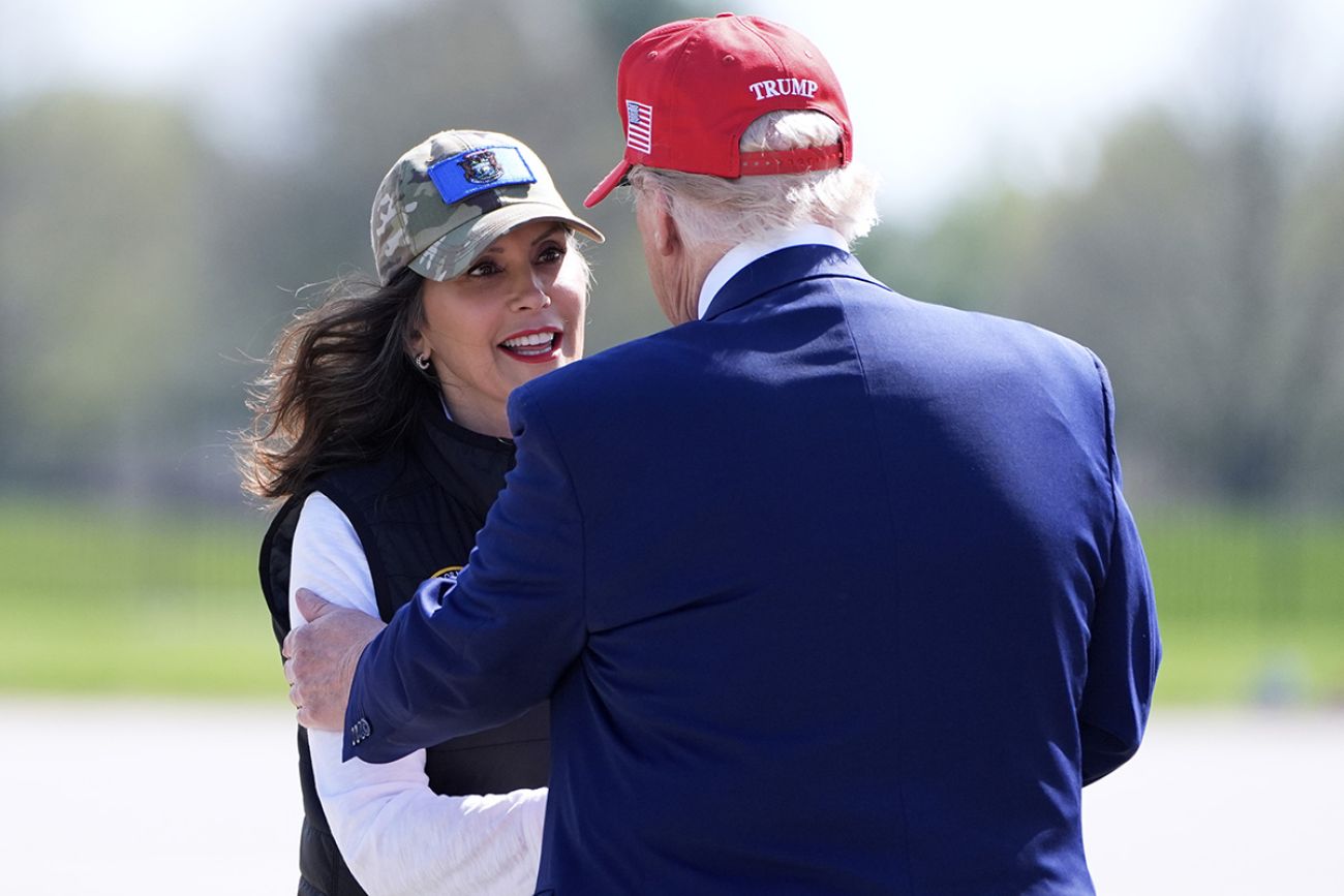 Michigan Gov. Gretchen Whitmer shakes President Donald Trump hand.
