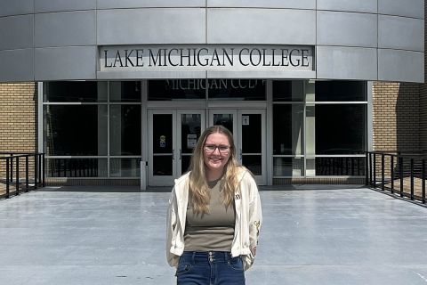 woman standing in front college