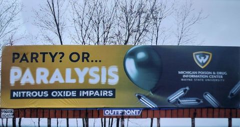 Billboard that says "Party? Or Paralysis"