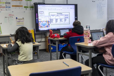 Three students in the classroom.