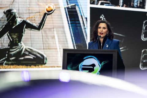 Gov. Gretchen Whitmer speaking at the Detroit Auto Show.
