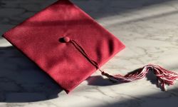 A red graduation hat. 