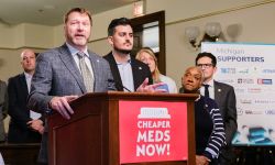 Michigan Rep. Matt Longjohn of Portage speaks at a press conference. Other lawmakers are behind him.