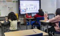 Three students in the classroom.