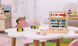 Different toys on table in playroom. Kindergarten interior