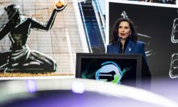 Gov. Gretchen Whitmer speaking at the Detroit Auto Show.