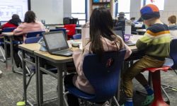 Kids sit in classroom